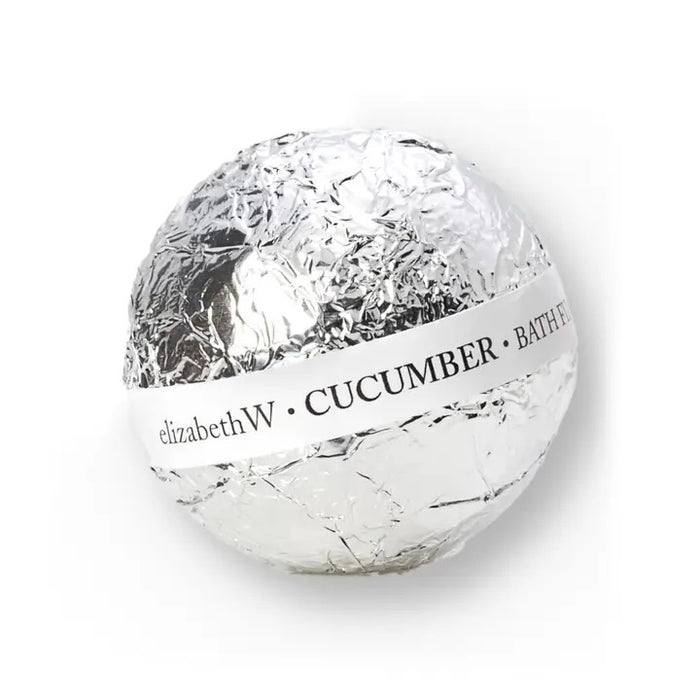 A handcrafted round BATH FIZZ BALL CUCUMBER by E WIGHTMAN & CO, wrapped in shiny silver foil with a white label—perfect for adding a refreshing, fragrant fizz to your bath.