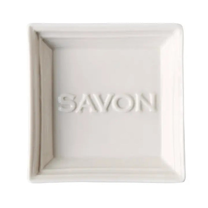 Elegant and simple, the CERAMIC SOAP DISH by EUROPEAN SOAPS, LLC features "SAVON" embossed in the center, adding a refined touch to any bathroom decor.