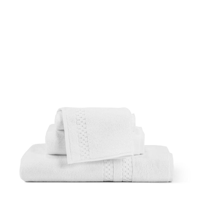 The FEARRINGTON LIFESTYLE TOWEL COLLECTION - WASH CLOTH by Frette North America features a plush cotton wash cloth in luxury white with a textured decorative band, neatly folded on a light, plain background.