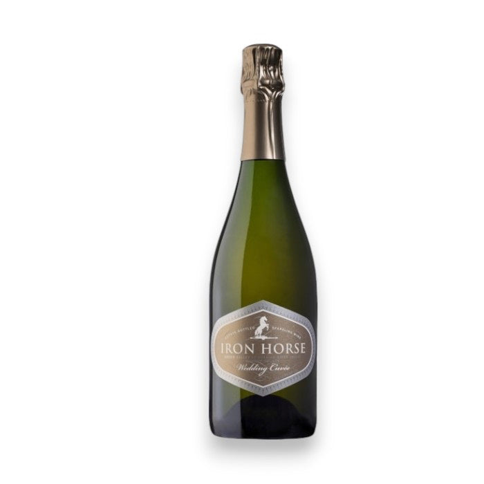 An Iron Horse Wedding Cuvée, by Johnson Bros./Mutual/Epiphany, showcases a dark green glass bottle with foil on its neck. The label states "IRON HORSE WEDDING CUVEE," set against a plain white background, reflecting the elegance of Sonoma County's Russian River Valley.