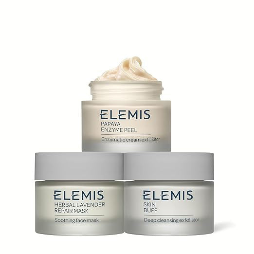 A rectangular box of ELEMIS - STEINER KIT DEEP CLEANSING MASK TRIO, designed to exfoliate and brighten skin, features the brand name at the top, product name vertically, and three cream smears on white and light blue packaging.
