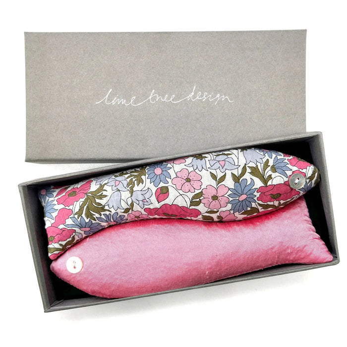The LAVENDER FISH AND CINDERELLA SACHET by LIME TREE COLLECTION LTD includes two handmade, fish-shaped pouches—one floral and one pink, each with a button eye—ideal as scented sachets for drawers.