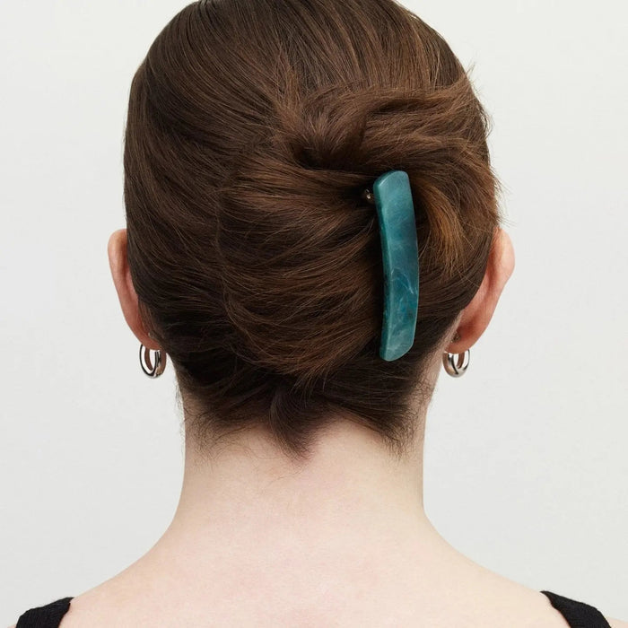 An expertly crafted rectangular barrette with smooth, rounded edges in an alabaster ivory hue—MACHETE’s No. 3 Heirloom Barrette—handmade in France from premium cellulose acetate, is centered on a plain white background.