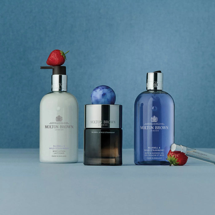 A white pump bottle of MOLTON BROWN Bluebell & Wild Strawberry Body Lotion with silver details, displayed on a plain white background—ideal for fans of floral and fruity scents.