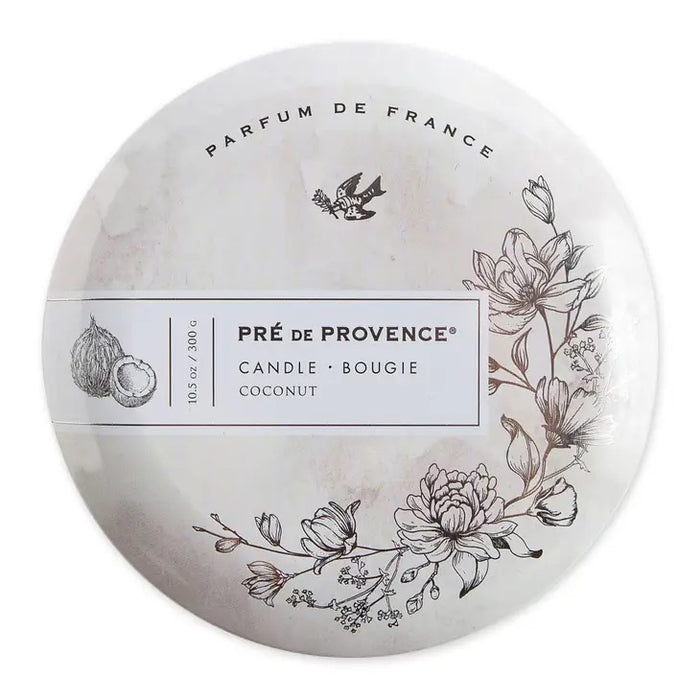 White round tin labeled “3 WICK CANDLE - COCONUT” by EUROPEAN SOAPS, LLC features floral art, coconut and bird motifs, and the phrase “Parfum de France.” Elegant minimalist lid holds a milky-scented candle for a refined home atmosphere.
