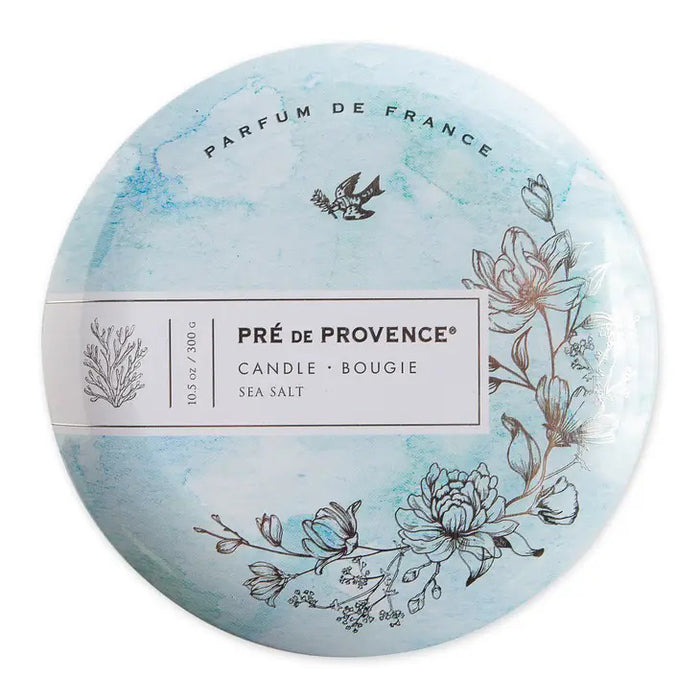 Round tin lid for the 3 Wick Candle - Sea Salt by European Soaps, LLC, features blue watercolor art, floral and seaweed designs, a flying bird, and “Parfum de France”—ideal for fans of unique signature fragrances.