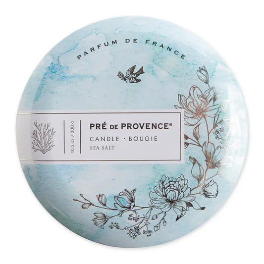 Round tin lid for the 3 Wick Candle - Sea Salt by European Soaps, LLC, features blue watercolor art, floral and seaweed designs, a flying bird, and “Parfum de France”—ideal for fans of unique signature fragrances.