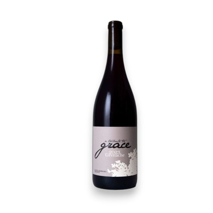 A bottle of WINE: KELLOGG SELECTIONS "A TRIBUTE TO GRACE GRENACHE 2024," with a white and gray floral label, is shown against a white background—a standout Santa Barbara County wine made with care.