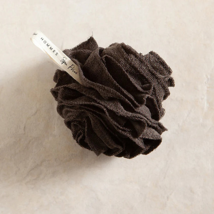 The BAMBOO POUF by EUROPEAN SOAPS, LLC is a black bamboo charcoal shower loofah in dark packaging with gold accents, adding an eco-friendly touch to your bath routine.