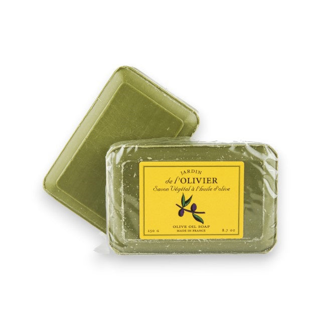 Two green rectangular BAUDELAIRE JARDIN DE L'OLIVIER Bath Bars—one upright with a yellow “Savon Végétal à l’huile d’olive” label, the other flat behind it. Both display a slightly rough, natural texture.