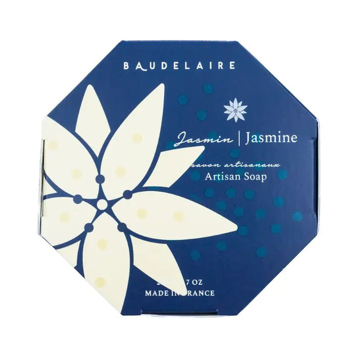 A blue octagonal box of BAUDELAIRE - JASMINE 7OZ BOXED BATH BAR displays a bold white floral design and text highlighting its jasmine scent and French origin.
