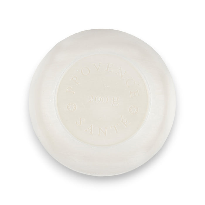 The BAUDELAIRE - LINDEN 7OZ BOXED BATH BAR comes in an octagonal blue box with a yellow and blue floral design, white text, and "Made in France" at the bottom. Enjoy its gentle shea butter formula and delicate floral scent.