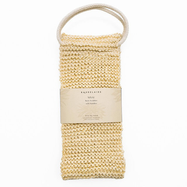 The BAUDELAIRE - SISAL BACK SCRUBBER by BAUDELAIRE is a beige, hand-knit sisal washcloth with a white looped handle for natural exfoliation and comes wrapped in a cream label.