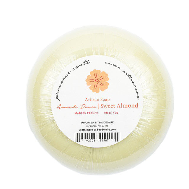 An orange, octagonal box labeled "BAUDELAIRE - SWEET ALMOND 7OZ BOXED BATH BAR" with a large yellow flower illustration. This French-milled soap is 7oz, made in France, and features English and French text.