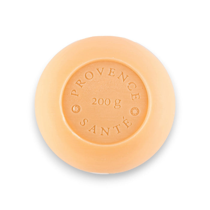 A yellow, octagonal box featuring green leaf patterns and blue accents holds the BAUDELAIRE - VETIVER 7OZ BOXED BATH BAR. The packaging indicates 200g (7oz) and “Made in France,” emphasizing this French-milled vetiver bath bar from Baudelaire with a sophisticated unisex fragrance.