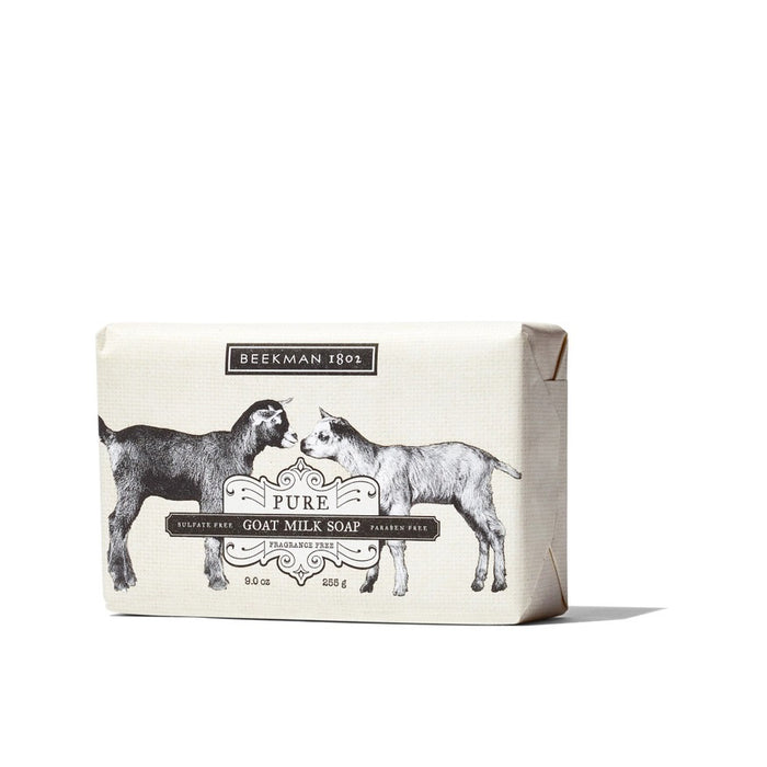 A 9oz BEEKMAN - PURE GOAT MILK SOAP BAR by BEEKMAN - STA ELEMENTS, packaged in paper featuring black and white illustrations of two goats facing each other, with the product and brand name displayed.
