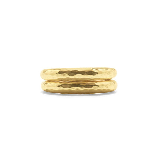 The CAPUCINE DE WULF - CLEOPATRA SLICE STACKING RINGS, featuring a textured hammered finish of 18K Gold over Brass, are displayed on a white background. Their shiny surface subtly reflects light.