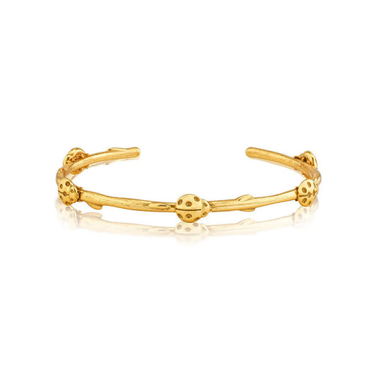 The CAPUCINE DE WULF Meadow Ladybug Petite Bangle is a handmade gold bangle bracelet with an open design and textured elements resembling ladybugs, featuring a polished finish for elegance.
