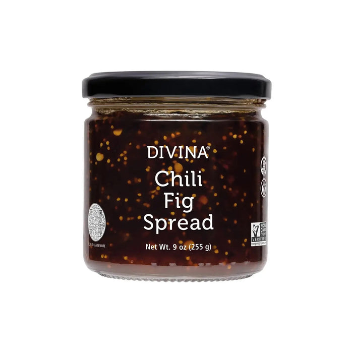 A jar of DIVINA - CHILI FIG SPREAD with a black lid features a label displaying its name and weight, 9 oz (255 g). This dark, sweet, spicy spread with visible seeds is non-GMO and vegan certified—ideal for cheese pairing.