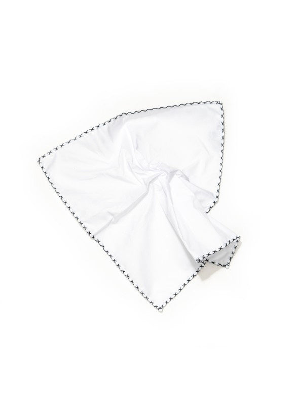 The EDWARD ARMAH Hem Stitched Pocket Square features a white cotton design with scalloped edges and black stitched X patterns, displayed against a crisp white background.