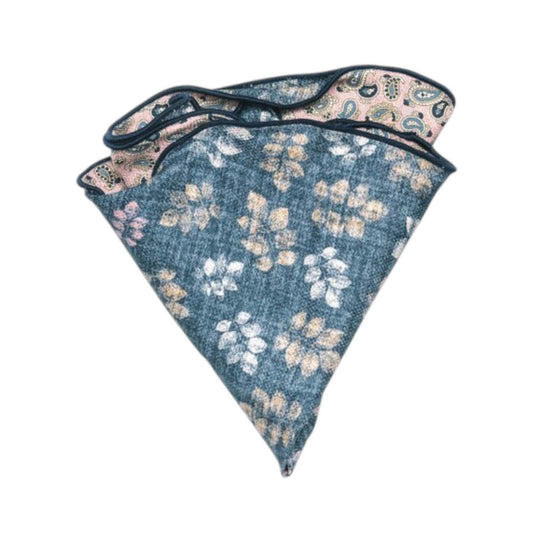 The EDWARD ARMAH Reversible Silk Pocket Circle in Pink Denim Leaf features blue and beige floral patterns on one side and a contrasting pink and green paisley print on the reverse.