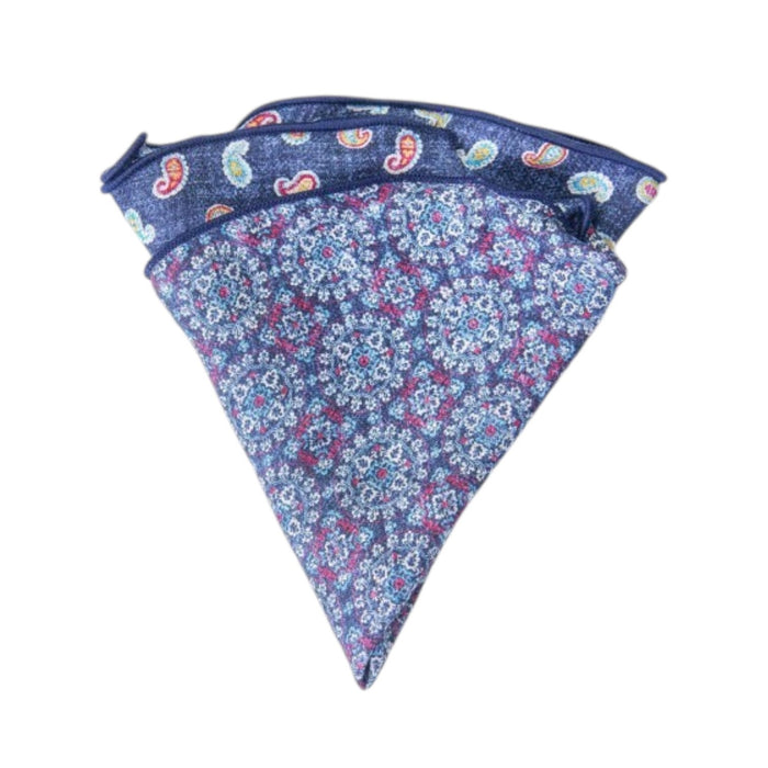 The EDWARD ARMAH Silk Reversible Pocket Circle Denim Paisley features a blue silk design with a purple and white floral pattern and a paisley print on the reverse side.