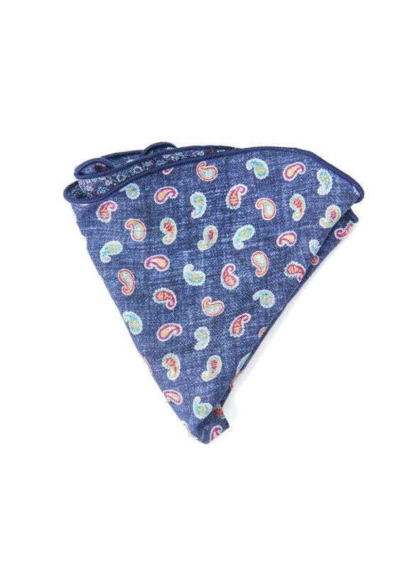 The EDWARD ARMAH Silk Reversible Pocket Circle Denim Paisley features a blue silk design with a purple and white floral pattern and a paisley print on the reverse side.