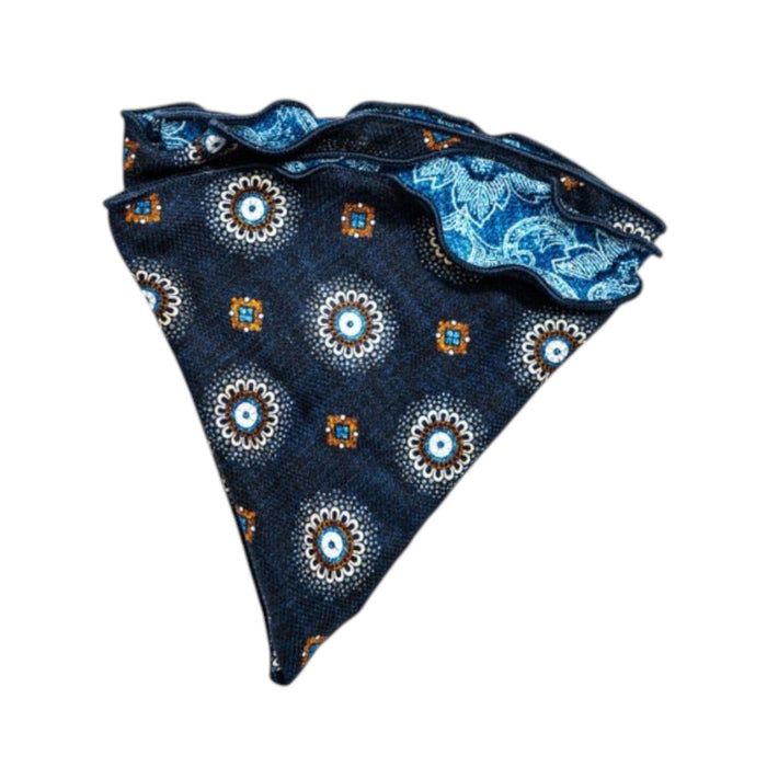 The EDWARD ARMAH - SILK REVERSIBLE POCKET CIRCLE IN NAVY MEDALLION features a crisp white background with navy medallion, floral, and geometric patterns, accented by light blue, white, and orange for a refined touch.