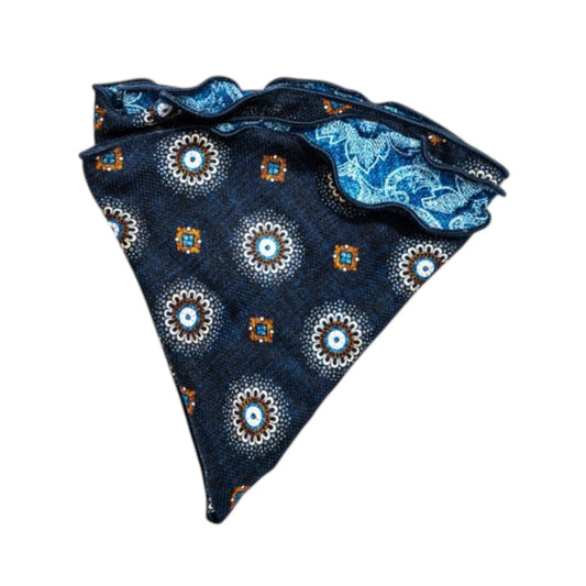 The EDWARD ARMAH - SILK REVERSIBLE POCKET CIRCLE IN NAVY MEDALLION features a crisp white background with navy medallion, floral, and geometric patterns, accented by light blue, white, and orange for a refined touch.