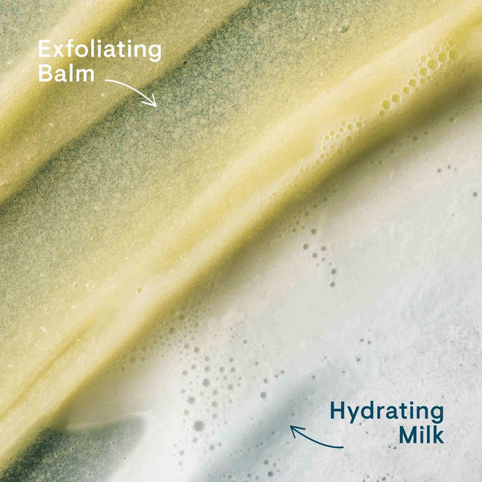 A blue tube of ELEMIS - PRO-COLLAGEN GLOW BOOST EXFOLIATOR by ELEMIS - STEINER stands upright with a silver cap against a white background, featuring the product name and details in silver and black on the front.
