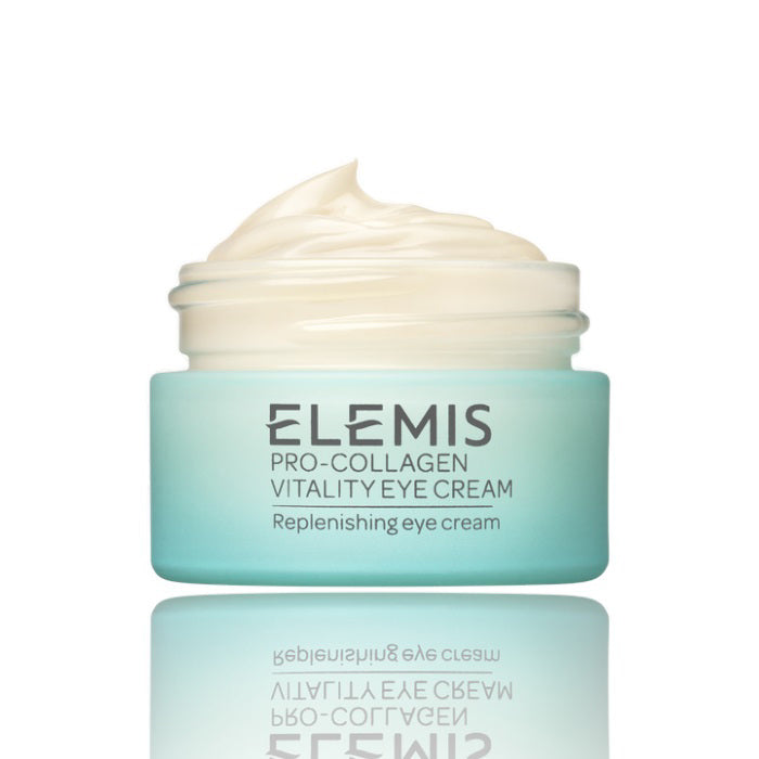 A light blue jar of ELEMIS - PRO-COLLAGEN VITALITY EYE CREAM by ELEMIS - STEINER, filled with creamy off-white product. The label says "Replenishing eye cream" and the jar sits on a white background with a visible reflection beneath it.