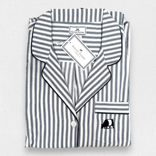 A folded PETITE PLUME Women's Twill Pajama Top from the FEARRINGTON LIFESTYLE COLLECTION, featuring navy French ticking stripes, long sleeves, a front pocket with small animal embroidery, and a tag by the collar.