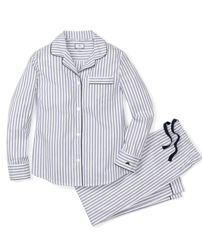 A folded PETITE PLUME Women's Twill Pajama Top from the FEARRINGTON LIFESTYLE COLLECTION, featuring navy French ticking stripes, long sleeves, a front pocket with small animal embroidery, and a tag by the collar.