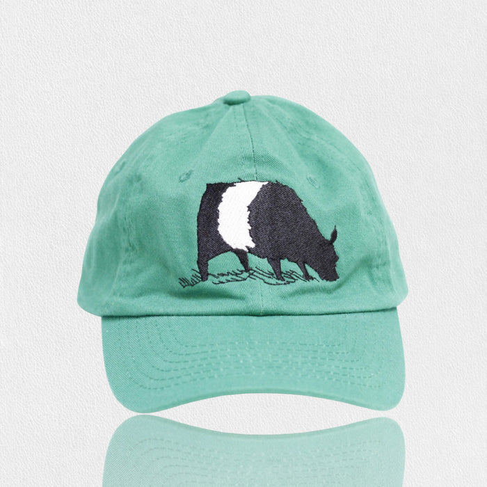 The VALUCAP THREDS FEARRINGTON LIFESTYLE COLLECTION - YOUTH BELTIE TWILL HAT is a blue cotton cap with an embroidered black and white badger on the front, displayed on a plain white background.