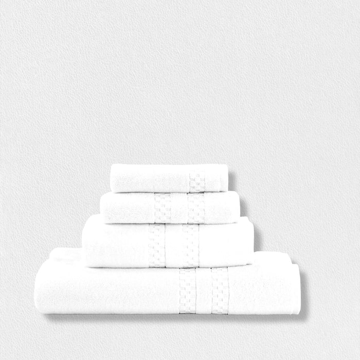 Four FEARRINGTON LIFESTYLE BATH TOWELS by Frette North America, neatly folded and stacked against a white background, highlight the elegance and comfort of luxury bath linens.