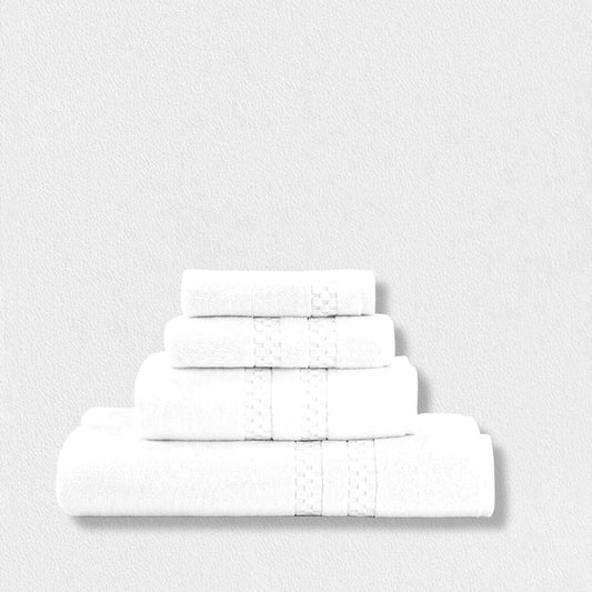 Four FEARRINGTON LIFESTYLE HAND TOWELS by Frette North America are stacked against a white textured background, featuring a subtle decorative band for an elegant touch to these luxury bath linens.