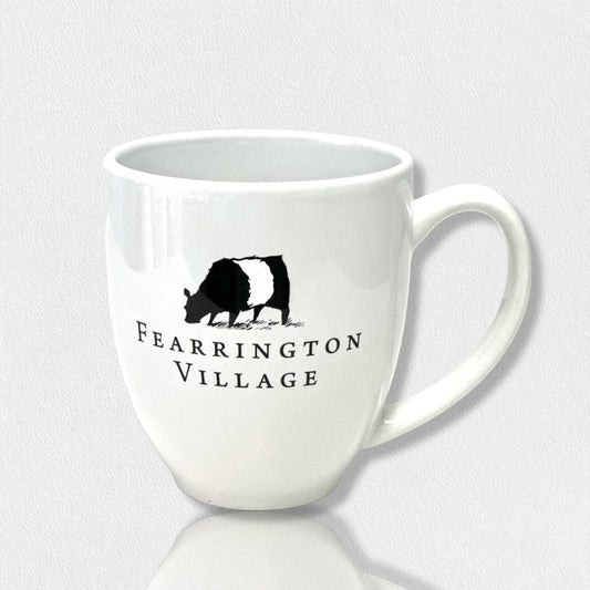The FEARRINGTON SIGNATURE COLLECTION - FEARRINGTON COFFEE MUG 1 COW 3RD EDITION by STRAN PROMOTIONAL SOLUTIONS is a 16 oz white ceramic mug with a black and white cow illustration and "Fearrington Village" text, handle shown on the right side.