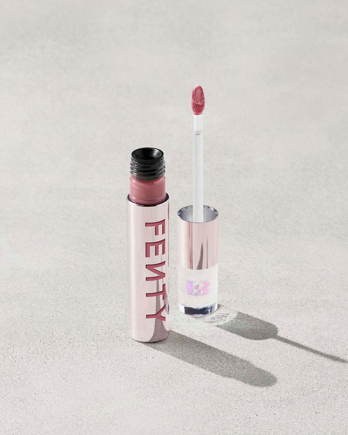 An open Fenty Icon Velvet lipstick tube on a light background.