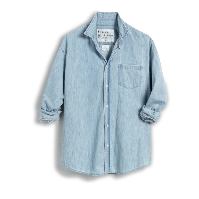 The FRANK & EILEEN LUKE Men's Button Up Shirt in Famous Denim Classic Wash features light blue 100% cotton denim, a loose fit, straight hem, and rolled long sleeves. Displayed from the back against a white background.
