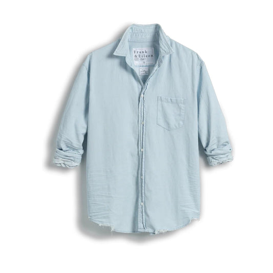 The FRANK & EILEEN LUKE Men's Button Up Shirt in Famous Denim Classic Denim Tattered Wash is shown from the back, with long sleeves, buttoned cuffs, a curved hem, and an oversized relaxed fit for a casual look.