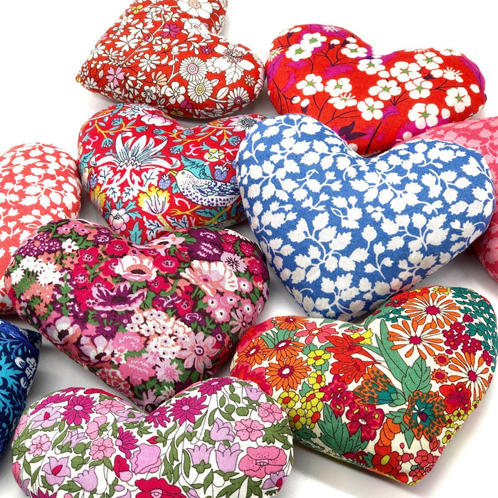 Two fabric heart-shaped LIME TREE COLLECTION LTD "HEARTS - LOVEY DOVEY SACHET" in pink floral and dark blue Liberty Tana Lawn are presented in a grey "lime tree design" box. Ideal as lavender drawer sachets.