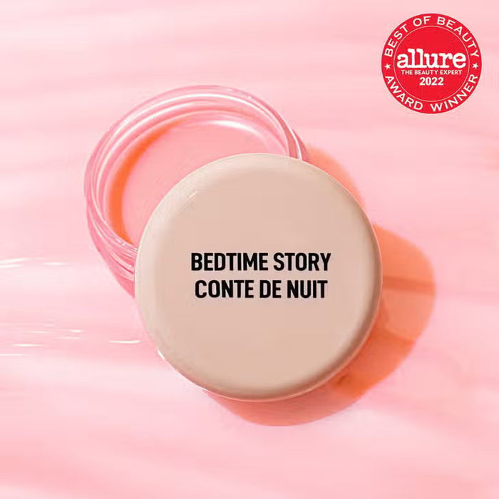 A round beige container labeled "JASON WU - GOODNIGHT MR WU LIP MASK" by JASON WU BEAUTY sits open on a pink surface, suggesting its shea butter-rich overnight formula. A red "Allure Best of Beauty Award Winner 2022" badge appears in the upper right.