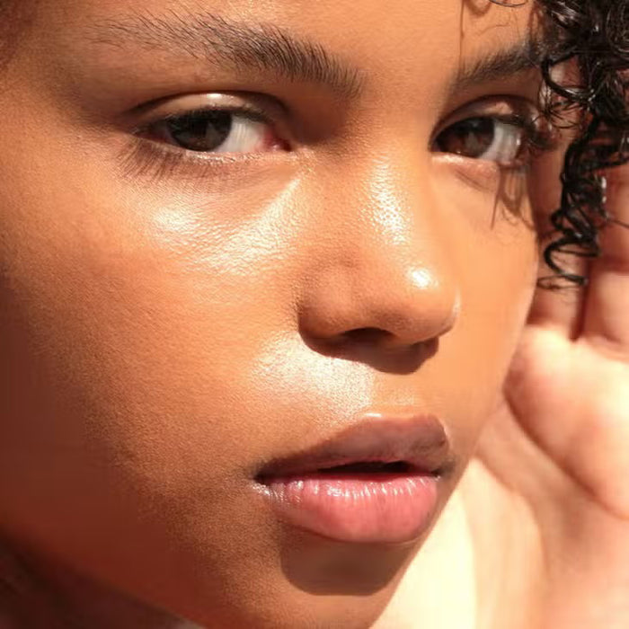 A round beige container labeled "JASON WU - GOODNIGHT MR WU LIP MASK" by JASON WU BEAUTY sits open on a pink surface, suggesting its shea butter-rich overnight formula. A red "Allure Best of Beauty Award Winner 2022" badge appears in the upper right.