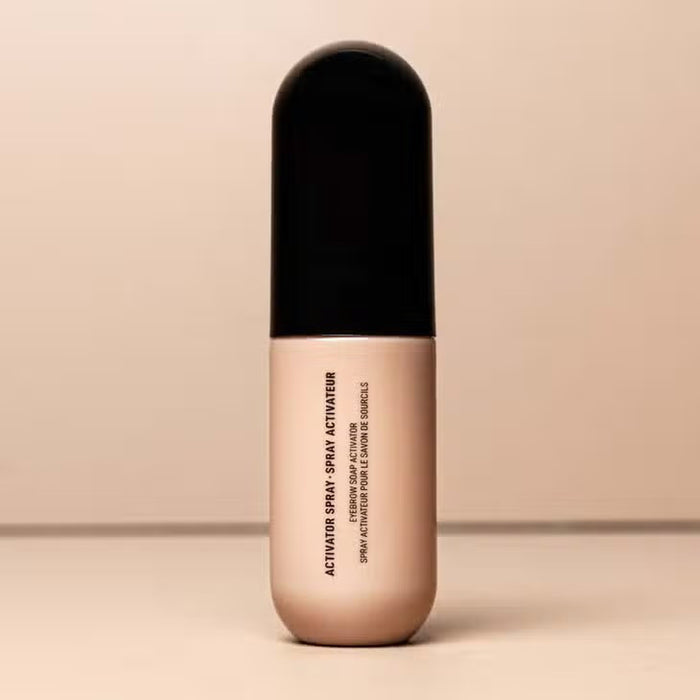 A bottle of JASON WU BEAUTY JASON WU - MIST-ER SOAP STAR BROW SOAP, ideal for brow styling routines, stands upright with a beige base and black cap against a neutral background. The product name appears vertically on the bottle.