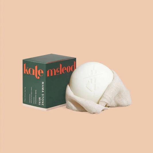 A chart contrasts the KATE MCLEOD - MAMA STONE MINI DEEP MOISTURIZING LOTION BAR 1OZ—a natural, round bar ideal for stretch mark prevention—with typical pump lotions containing diluted actives and added chemicals.