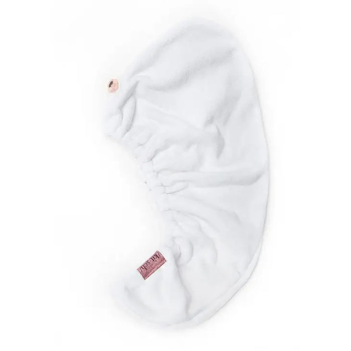 The KITSCH - QUICK DRY HAIR TOWEL, suitable for frizzy, curly, or straight hair, comes in a clear plastic bag labeled "/kit·sch/ CLEANSE," and boasts quick-drying microfiber that effectively reduces frizz.