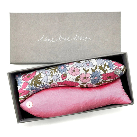 The LAVENDER FISH AND CINDERELLA SACHET by LIME TREE COLLECTION LTD includes two handmade, fish-shaped pouches—one floral and one pink, each with a button eye—ideal as scented sachets for drawers.