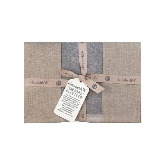 The LAVENDER PILLOW INSERT IN NATURAL LINEN by E WIGHTMAN & CO features a beige linen sachet filled with lavender, tied with a matching ribbon and product tag—a perfect aromatherapeutic sleep aid displayed on a white background.