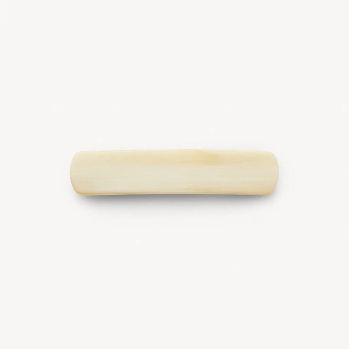 An expertly crafted rectangular barrette with smooth, rounded edges in an alabaster ivory hue—MACHETE’s No. 3 Heirloom Barrette—handmade in France from premium cellulose acetate, is centered on a plain white background.