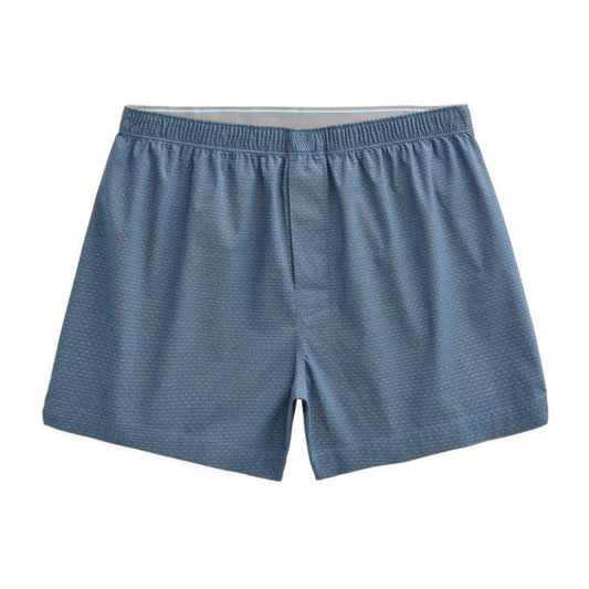A person is shown from the waist down, wearing MACK WELDON 24/7 Woven Boxer in True Navy Dobby Dot. The background is plain and light gray.